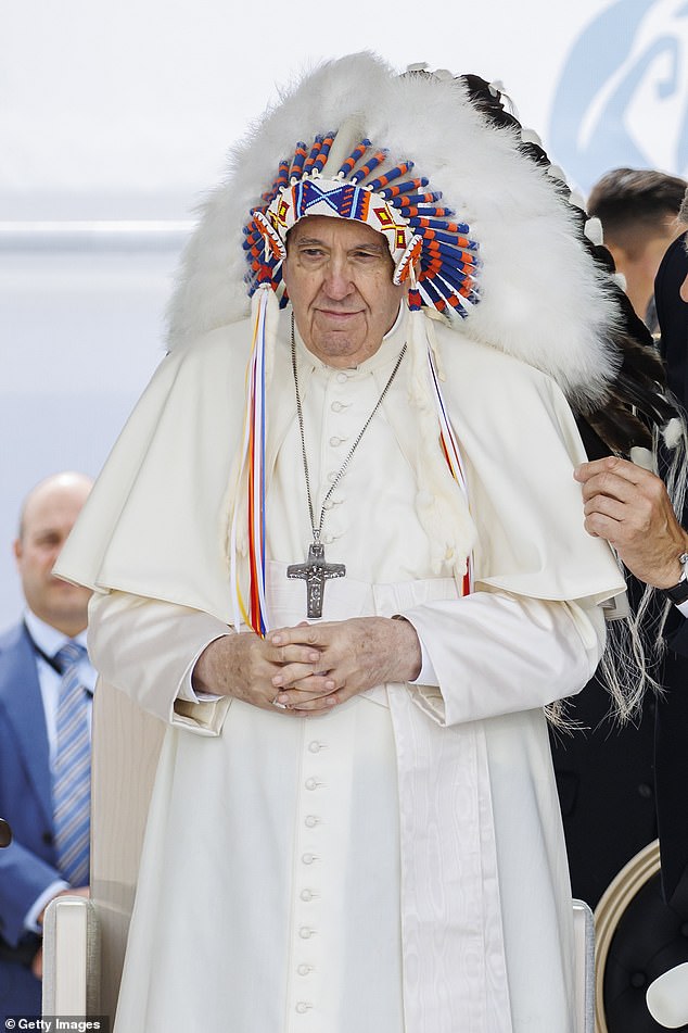 Antipope Bergoglio wearing feathers.